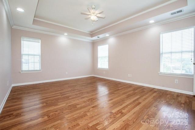 198 Devon Forest Dr, Mooresville, NC 28115 - unfurnished room featuring a raised ceiling, healthy amount of natural light, light wood-style flooring, ornamental molding, and recessed lighting