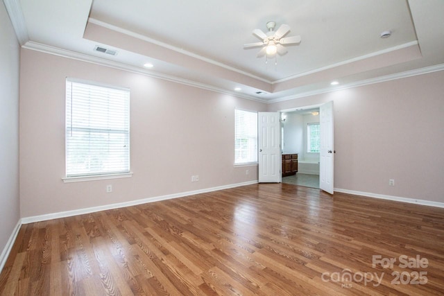 198 Devon Forest Dr, Mooresville, NC 28115 - spare room with a tray ceiling, ceiling fan, wood finished floors, and crown molding