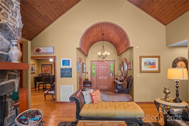 270 Foxwood Dr, Tryon, NC 28782 - foyer featuring hardwood / wood-style floors, a chandelier, wood ceiling, a fireplace, and high vaulted ceiling
