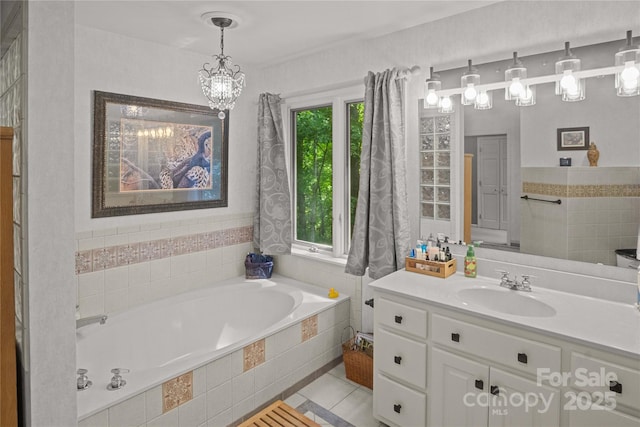 270 Foxwood Dr, Tryon, NC 28782 - full bath with a garden tub, vanity, a chandelier, and tile patterned flooring