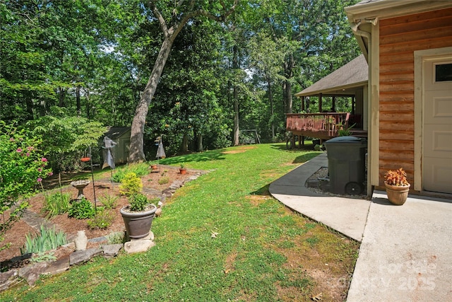 270 Foxwood Dr, Tryon, NC 28782 - view of green lawn with a shed and a wooden deck