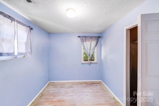 2116 Bon Villa Way, Fort Mill, SC 29708 - empty room featuring a textured ceiling and wood finished floors