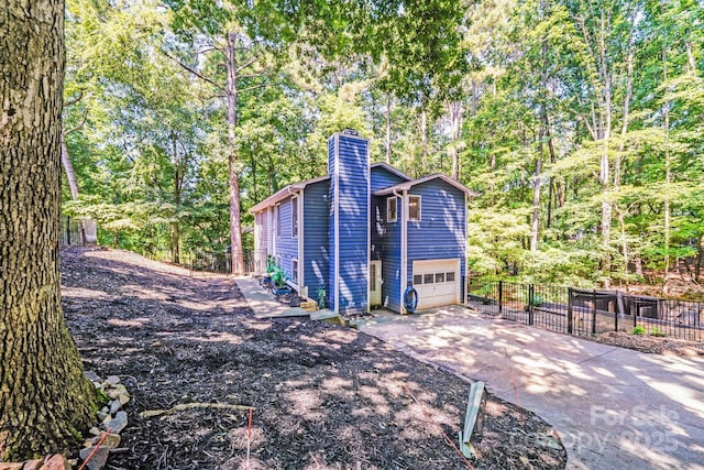 2116 Bon Villa Way, Fort Mill, SC 29708 - view of home's exterior featuring a chimney, driveway, and an attached garage