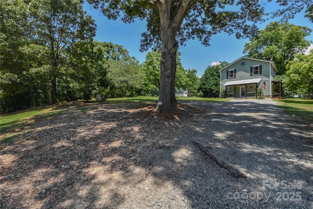 1239 Mac Ln, Stanley, NC 28164 - view of front of home featuring a porch and gravel driveway