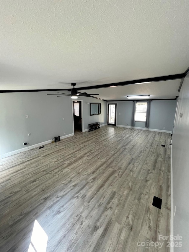6490 Alta Ctr, Denver, NC 28037 - unfurnished living room with a textured ceiling, a ceiling fan, and light wood finished floors