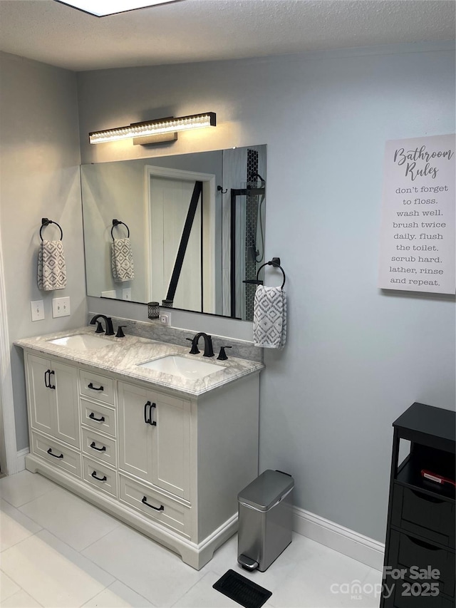 6490 Alta Ctr, Denver, NC 28037 - bathroom with double vanity and a textured ceiling
