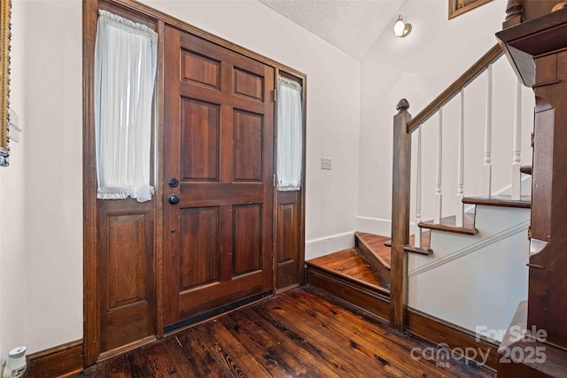 36433 Azalea Cir, New London, NC 28127 - entryway with dark wood-style floors, stairway, and a textured ceiling
