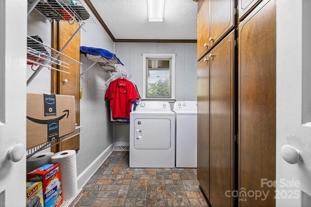 36433 Azalea Cir, New London, NC 28127 - laundry area with cabinet space, dark stone finish flooring, washing machine and dryer, a textured ceiling, and crown molding