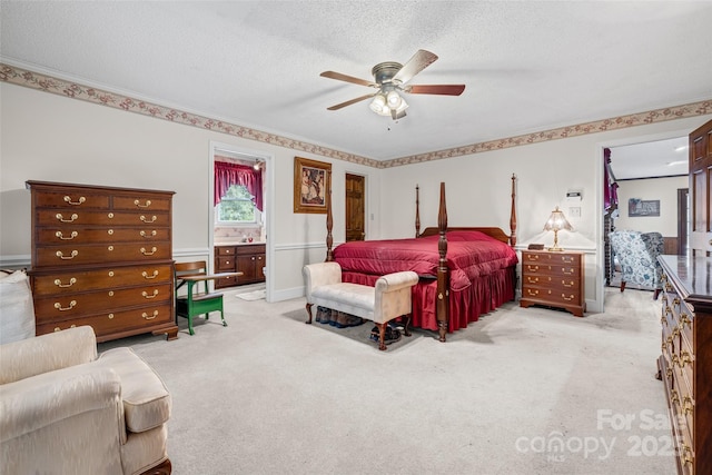 36433 Azalea Cir, New London, NC 28127 - carpeted bedroom with a textured ceiling, ensuite bathroom, crown molding, and a ceiling fan