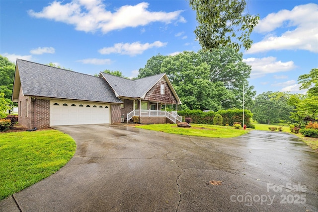 36433 Azalea Cir, New London, NC 28127 - view of front of home with driveway, brick siding, an attached garage, and a front yard