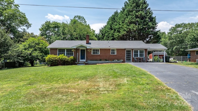 2623 NE 13th St NE, Hickory, NC 28601 - ranch-style house with driveway, brick siding, an attached carport, and a chimney