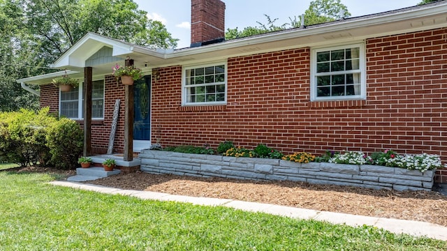 2623 NE 13th St NE, Hickory, NC 28601 - view of front of house with a chimney and brick siding