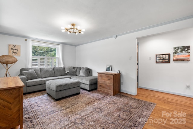 2623 NE 13th St NE, Hickory, NC 28601 - living area with a chandelier, wood finished floors, and crown molding