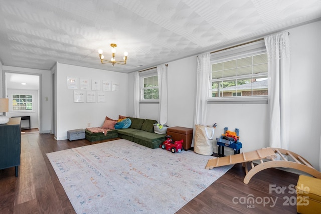 2623 NE 13th St NE, Hickory, NC 28601 - living area with wood finished floors, plenty of natural light, and a chandelier
