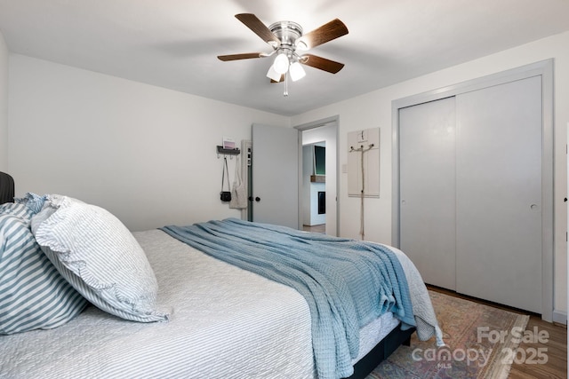 2623 NE 13th St NE, Hickory, NC 28601 - bedroom featuring wood finished floors, a closet, and a ceiling fan
