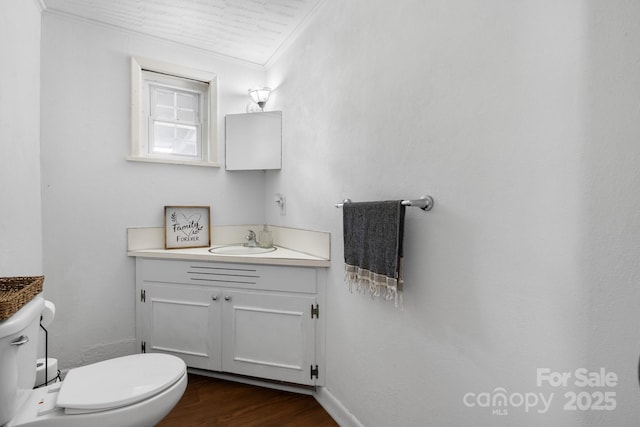 2623 NE 13th St NE, Hickory, NC 28601 - half bath with vanity, crown molding, and wood finished floors
