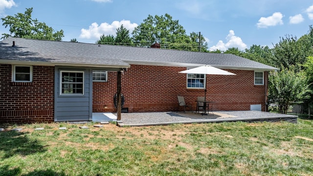 2623 NE 13th St NE, Hickory, NC 28601 - back of property featuring a lawn, a patio area, brick siding, and a shingled roof