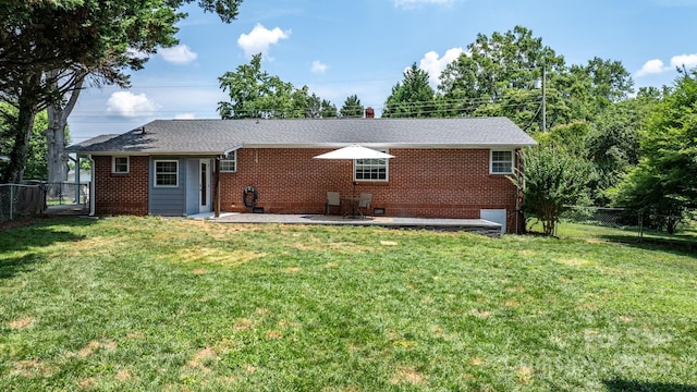 2623 NE 13th St NE, Hickory, NC 28601 - rear view of property with a fenced backyard, brick siding, and a patio