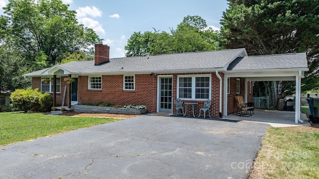 2623 NE 13th St NE, Hickory, NC 28601 - ranch-style house featuring driveway, a chimney, a front lawn, brick siding, and a shingled roof