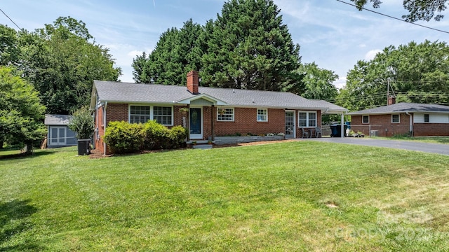 2623 NE 13th St NE, Hickory, NC 28601 - ranch-style house with brick siding, driveway, a front lawn, a carport, and a chimney
