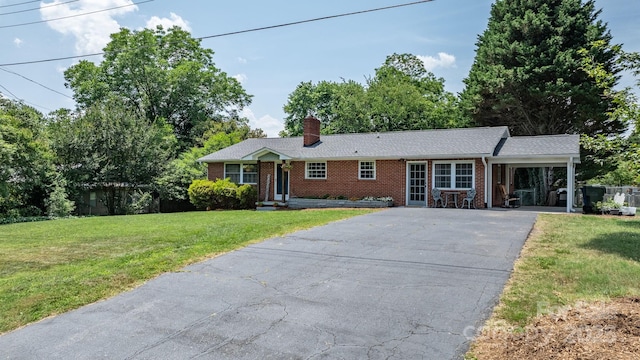 2623 NE 13th St NE, Hickory, NC 28601 - ranch-style home featuring brick siding, driveway, a front yard, a chimney, and an attached carport