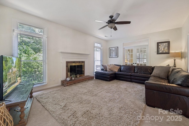 4716 Heatherton Pl, Charlotte, NC 28270 - carpeted living area with ceiling fan and a brick fireplace