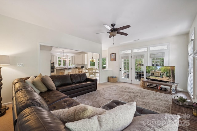4716 Heatherton Pl, Charlotte, NC 28270 - living area with ceiling fan, healthy amount of natural light, and light carpet