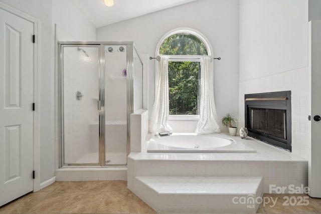 4716 Heatherton Pl, Charlotte, NC 28270 - full bath with vaulted ceiling, a shower stall, a jetted tub, tile patterned flooring, and a fireplace