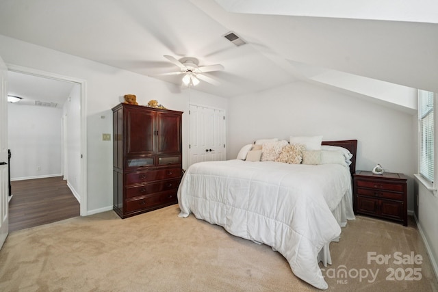 4716 Heatherton Pl, Charlotte, NC 28270 - carpeted bedroom featuring a closet, ceiling fan, and vaulted ceiling