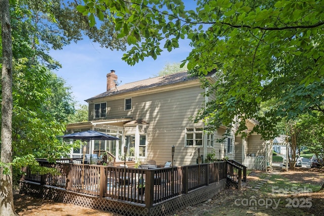 4716 Heatherton Pl, Charlotte, NC 28270 - rear view of property with a chimney and a wooden deck