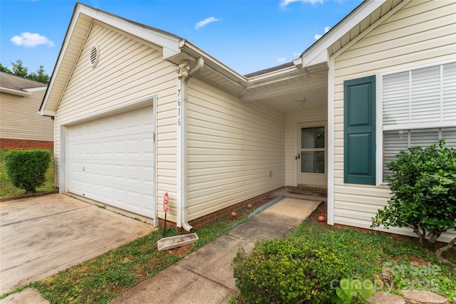 7616 Shiny Meadow Ln, Charlotte, NC 28215 - view of property exterior featuring a garage and concrete driveway