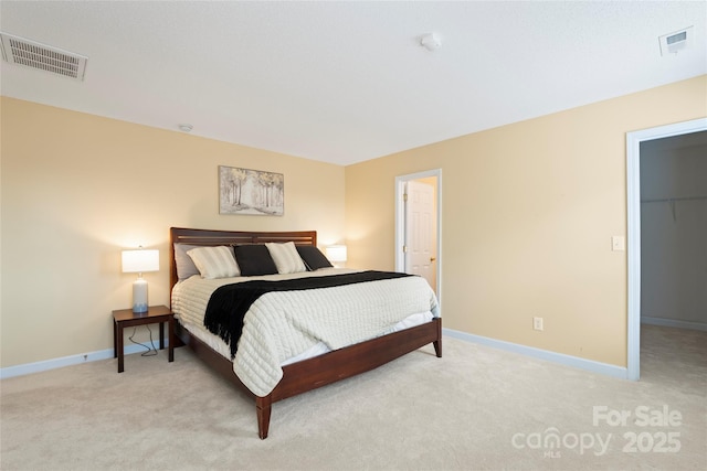 7616 Shiny Meadow Ln, Charlotte, NC 28215 - bedroom featuring light colored carpet, a spacious closet, and a closet
