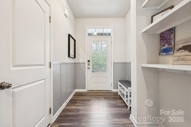 13323 Savaine St, Charlotte, NC 28278 - foyer with dark wood-type flooring and a wainscoted wall