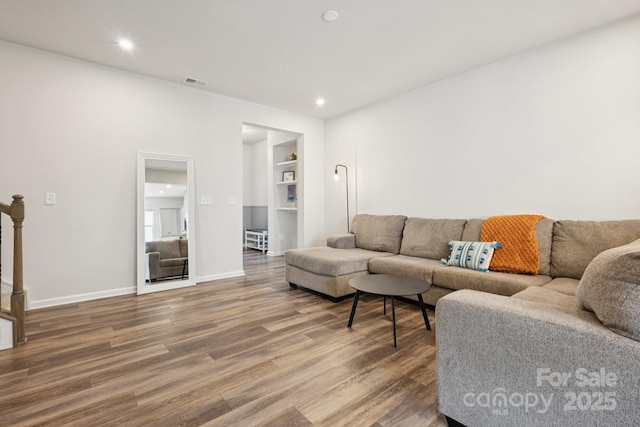 13323 Savaine St, Charlotte, NC 28278 - living room featuring wood finished floors, recessed lighting, and built in shelves