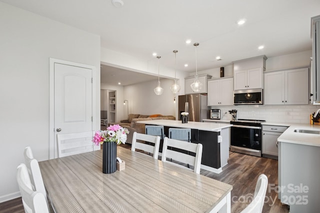 13323 Savaine St, Charlotte, NC 28278 - dining area featuring dark wood-style flooring and recessed lighting