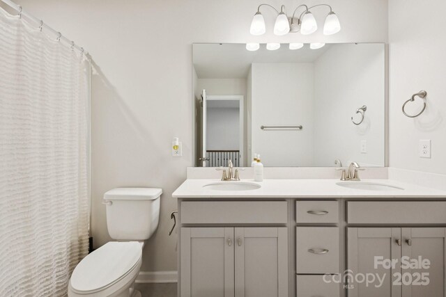 13323 Savaine St, Charlotte, NC 28278 - full bathroom featuring double vanity and curtained shower