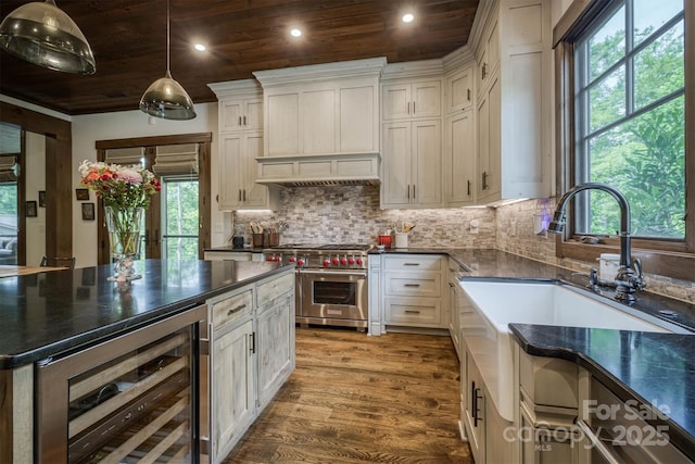 2101 October Dr Unit 150, Nebo, NC 28761 - kitchen featuring beverage cooler, double oven range, dark countertops, wood ceiling, and wood finished floors