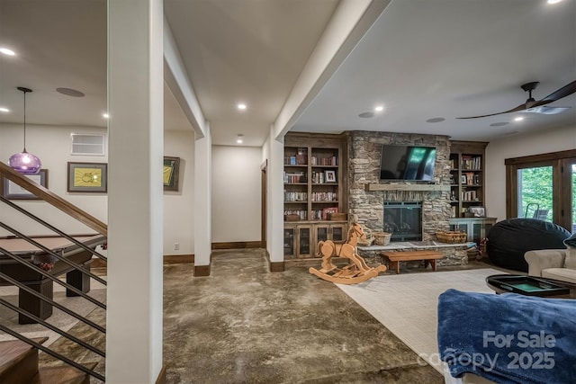 2101 October Dr Unit 150, Nebo, NC 28761 - living area featuring a ceiling fan, a fireplace, built in features, and recessed lighting