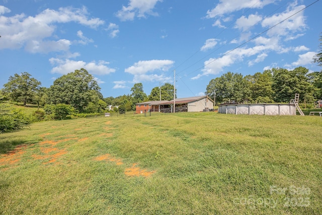 164 Dogtrot Rd, Mocksville, NC 27028 - view of green lawn with a covered pool
