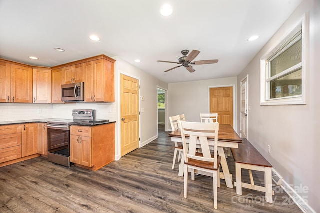 164 Dogtrot Rd, Mocksville, NC 27028 - kitchen with appliances with stainless steel finishes, dark wood finished floors, tasteful backsplash, dark countertops, and ceiling fan