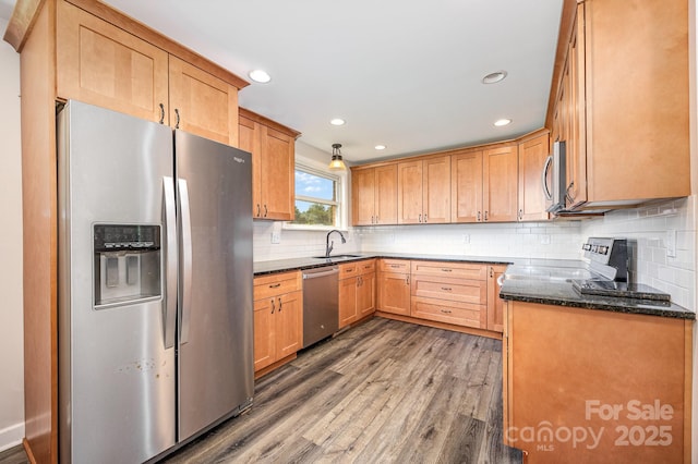 164 Dogtrot Rd, Mocksville, NC 27028 - kitchen with appliances with stainless steel finishes, wood finished floors, recessed lighting, decorative backsplash, and dark stone countertops