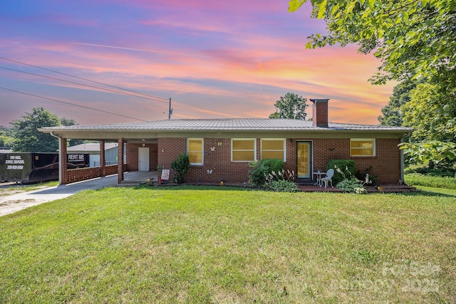 164 Dogtrot Rd, Mocksville, NC 27028 - single story home featuring a chimney, brick siding, a carport, and a front yard