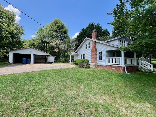 67 N Highland Ave, Granite Falls, NC 28630 - view of green lawn featuring covered porch, an outbuilding, and a detached garage