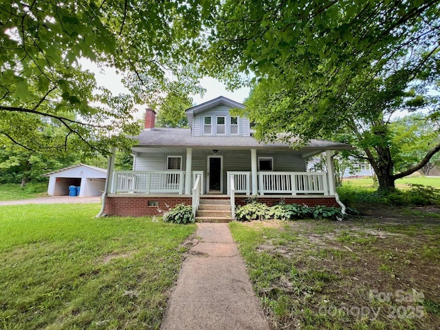 67 N Highland Ave, Granite Falls, NC 28630 - view of front of house featuring covered porch, a chimney, an outdoor structure, and a front yard