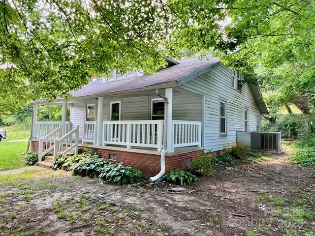 67 N Highland Ave, Granite Falls, NC 28630 - view of front of house featuring a porch, a shingled roof, and crawl space