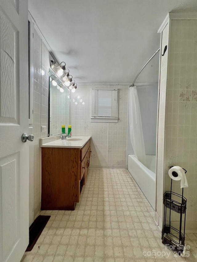 67 N Highland Ave, Granite Falls, NC 28630 - full bath featuring vanity, tile walls, shower / bath combo with shower curtain, and tile patterned floors