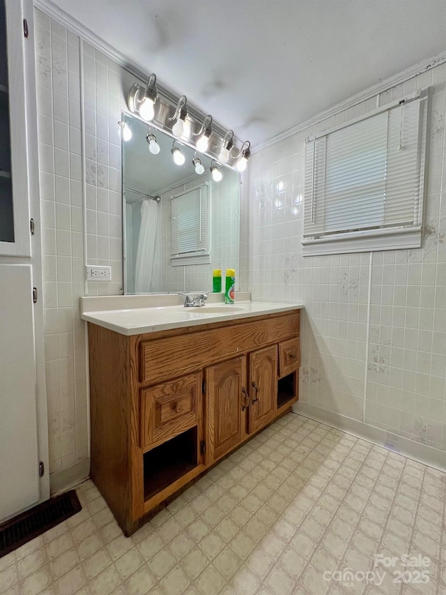 67 N Highland Ave, Granite Falls, NC 28630 - bathroom featuring tile patterned floors, vanity, and tile walls