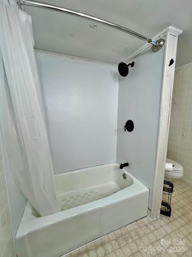67 N Highland Ave, Granite Falls, NC 28630 - bathroom featuring shower / bath combo with shower curtain, tile patterned floors, and tile walls