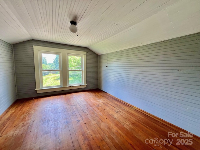 67 N Highland Ave, Granite Falls, NC 28630 - empty room with lofted ceiling, hardwood / wood-style floors, and wood walls