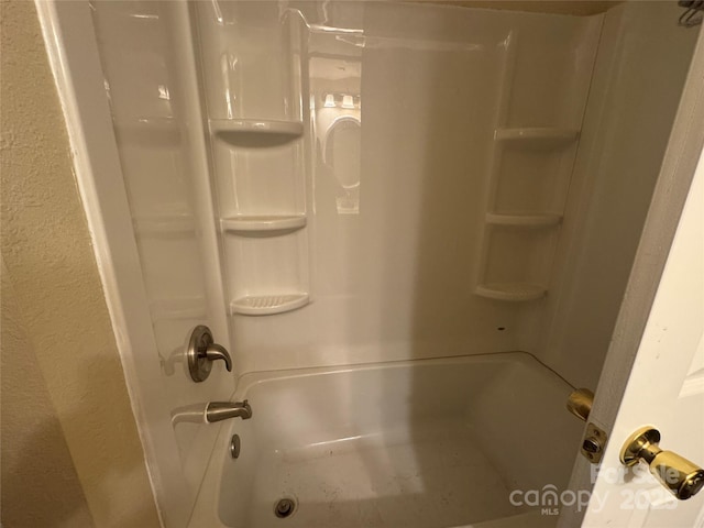 423 Crocus Ln, Sylva, NC 28779 - full bath featuring washtub / shower combination and a textured wall